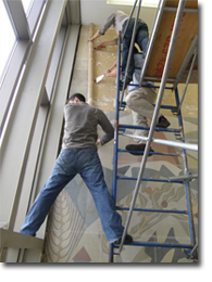 Conservator Pat Legris and his team remove the mural from its location at 1945 Graham Boulevard in Mont-Royal. St. Lawrence Cement, owners of the building from 1994 to 2008, provided the Canadian Museum of History with funds for its removal. Photo: Moira McCaffrey, 2008.
