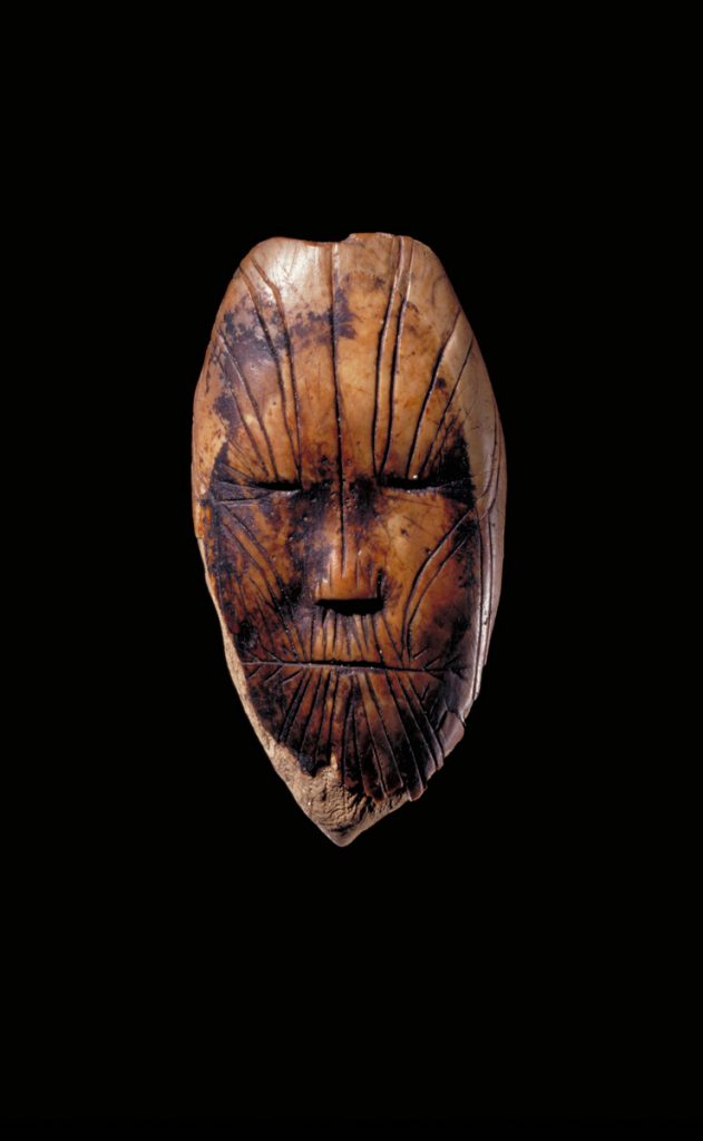 Carving of a human face