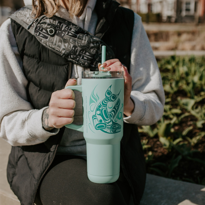 Insulated tumbler with indigenous whale design.