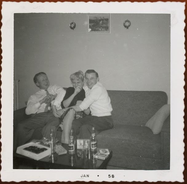 Erik Skov, Chris, and a friend at a Christmas party at Chris and Erik’s Bloor Street West apartment, Toronto, 1958