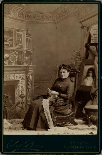 Photograph of Josephine Maud Spencer McTaggart sitting and crocheting