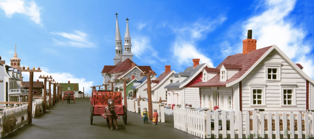 A horse and buggy on the main street. Notice how the people are not in proportion to the rest of the carvings. Playing with proportions and pushing the boundaries of realism are important characteristics of folk art. Canadian Museum of History, IMG2015-0289-0004-Dm