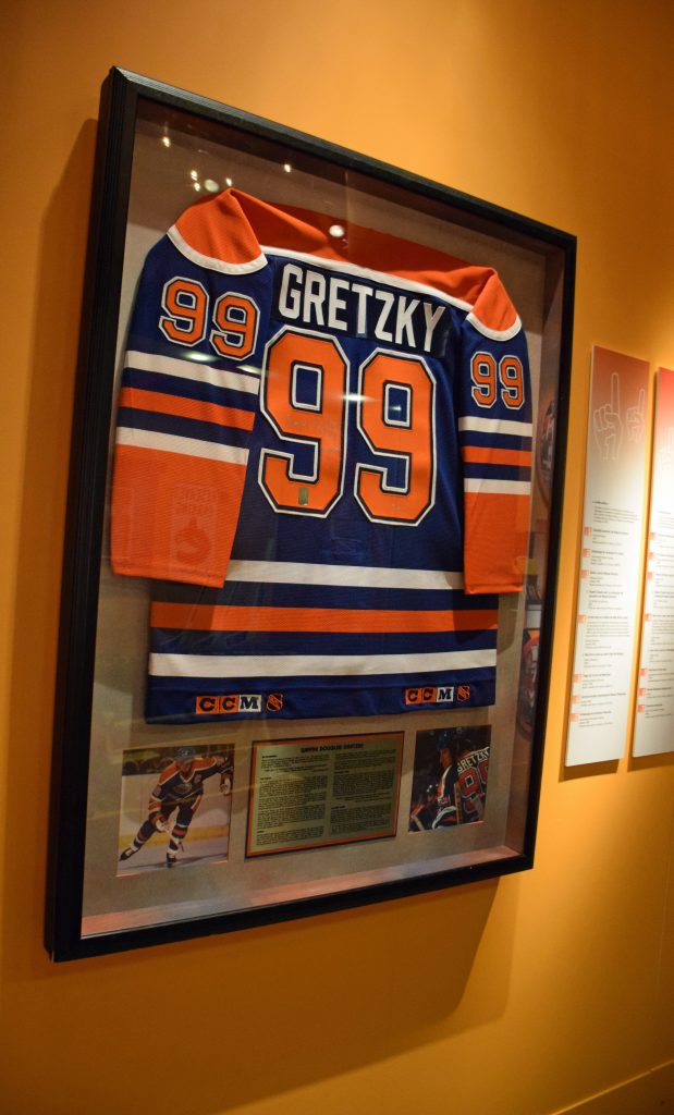 The commercial framing of this Wayne Gretzky jersey was altered to make use of more conservation friendly methods and materials, while retaining the original look. Photo: Canadian Museum of History. 