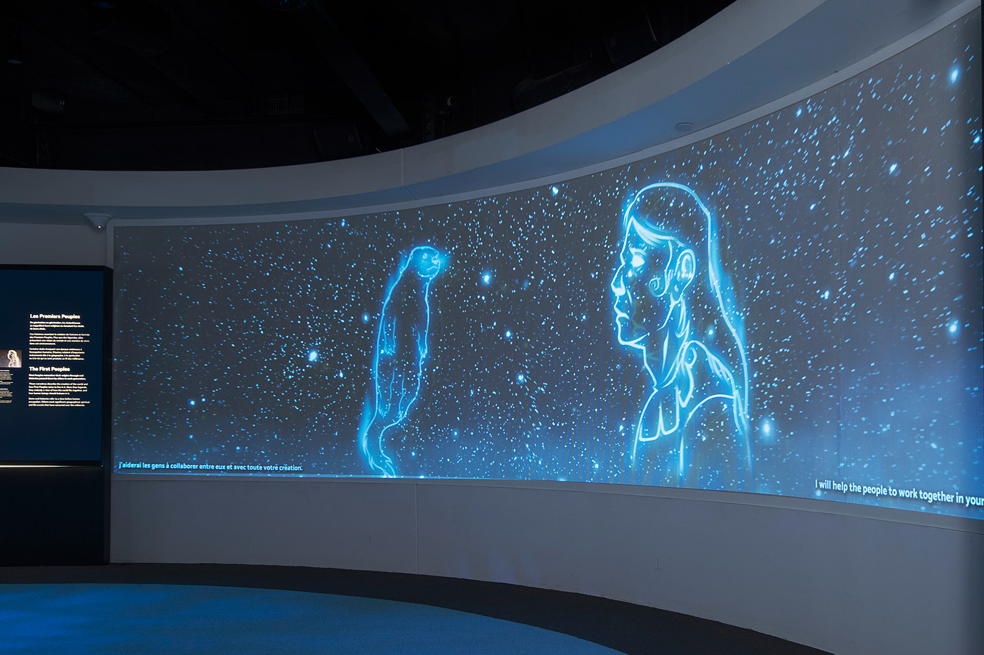 A room at the Canadian Museum of History in Ottawa, featuring a mesmerizing blue screen displaying captivating images of the universe.