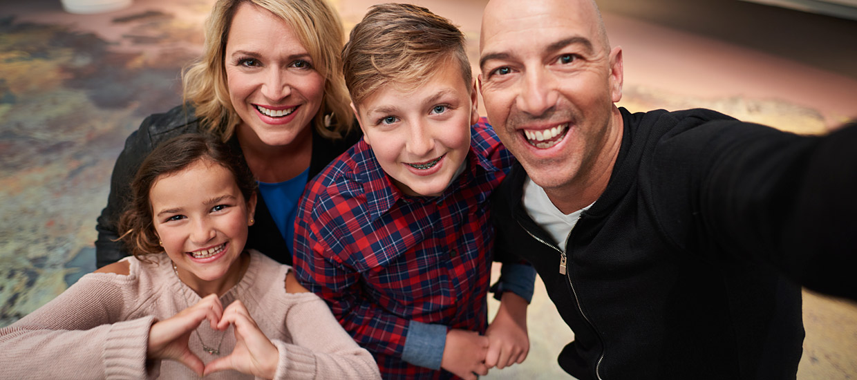 A family is taking a selfie at the Canadian Museum of History in Ottawa.