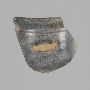 Fragment of a ceramic jar with dark blue and grey glaze
