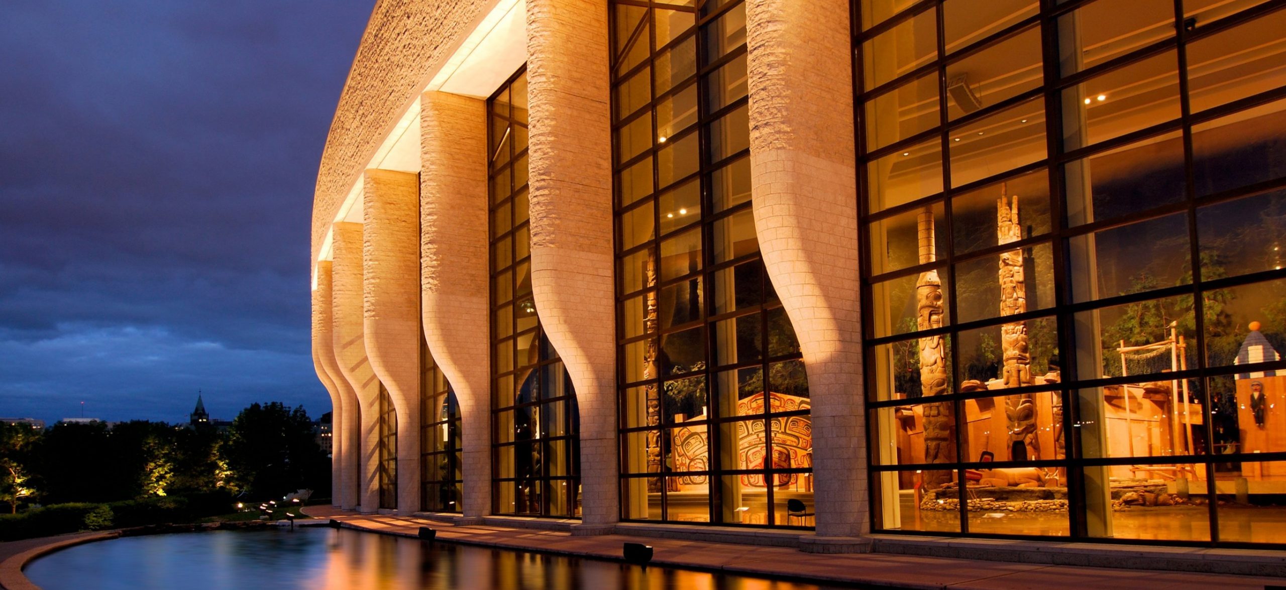 The Canadian Museum of History in Ottawa is an architectural marvel that boasts large windows, offering breathtaking views of the surrounding landscape, especially when illuminated at night. Furthermore, this iconic building showcases a captivating