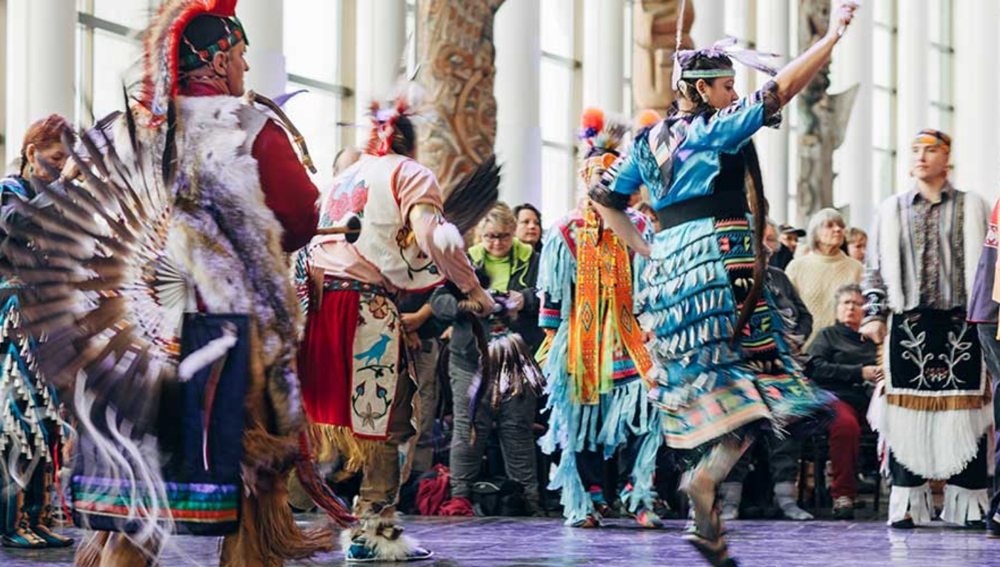 A group of Native American dancers performing at the Canadian Museum of History in Ottawa.