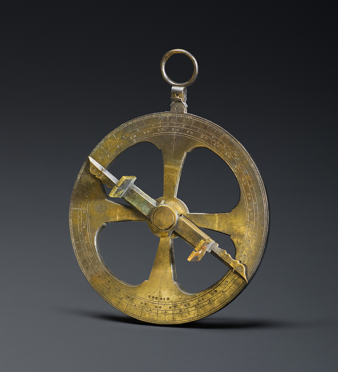 A brass compass on a black background at the Canadian Museum of History in Ottawa.