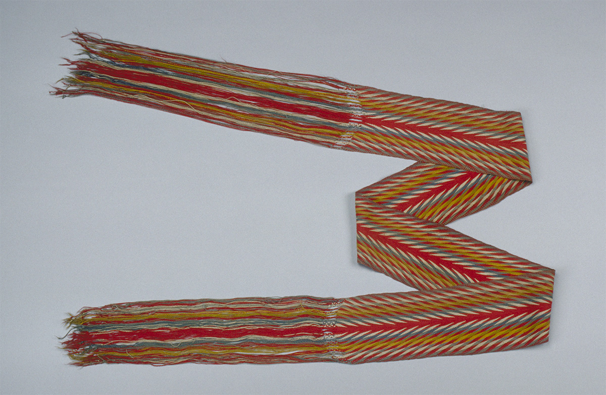 A red, yellow, and orange striped scarf.