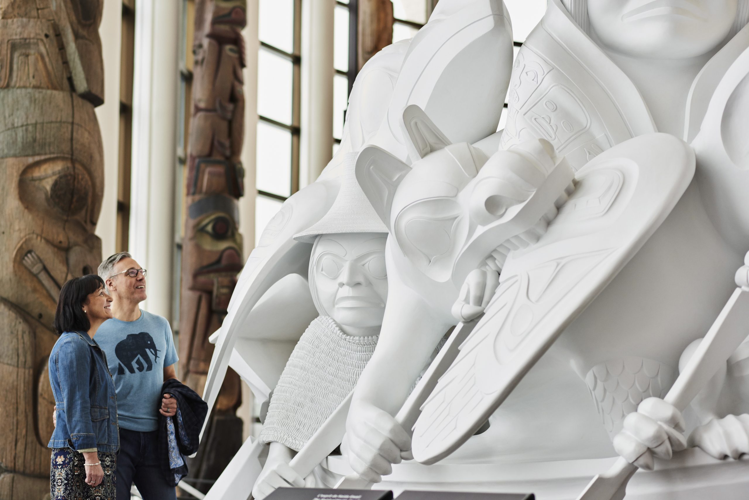 A couple admiring a white sculpture at the Canadian Museum of History in Ottawa.