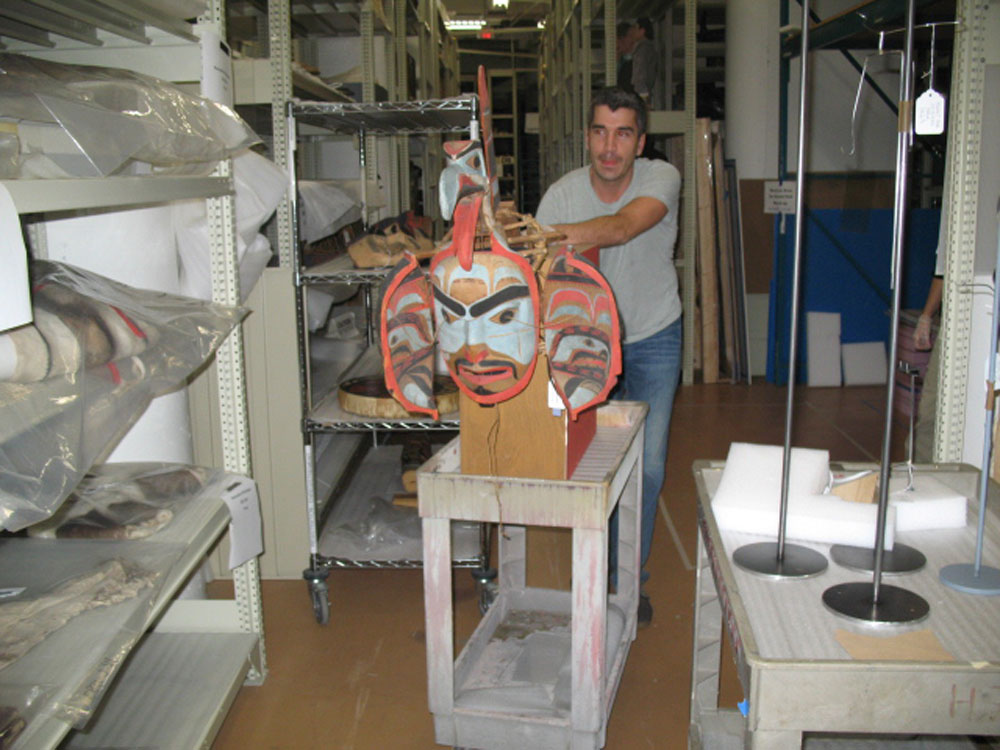 A man holding a mask at the Canadian Museum of History in Ottawa.