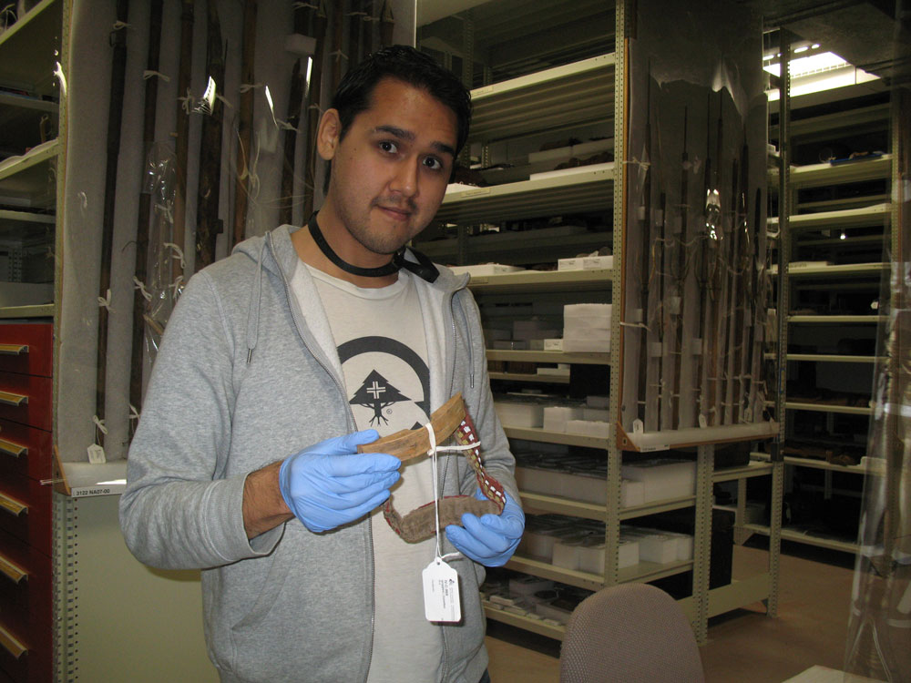 A man wearing a gray sweatshirt explores the Canadian Museum of History in Ottawa.