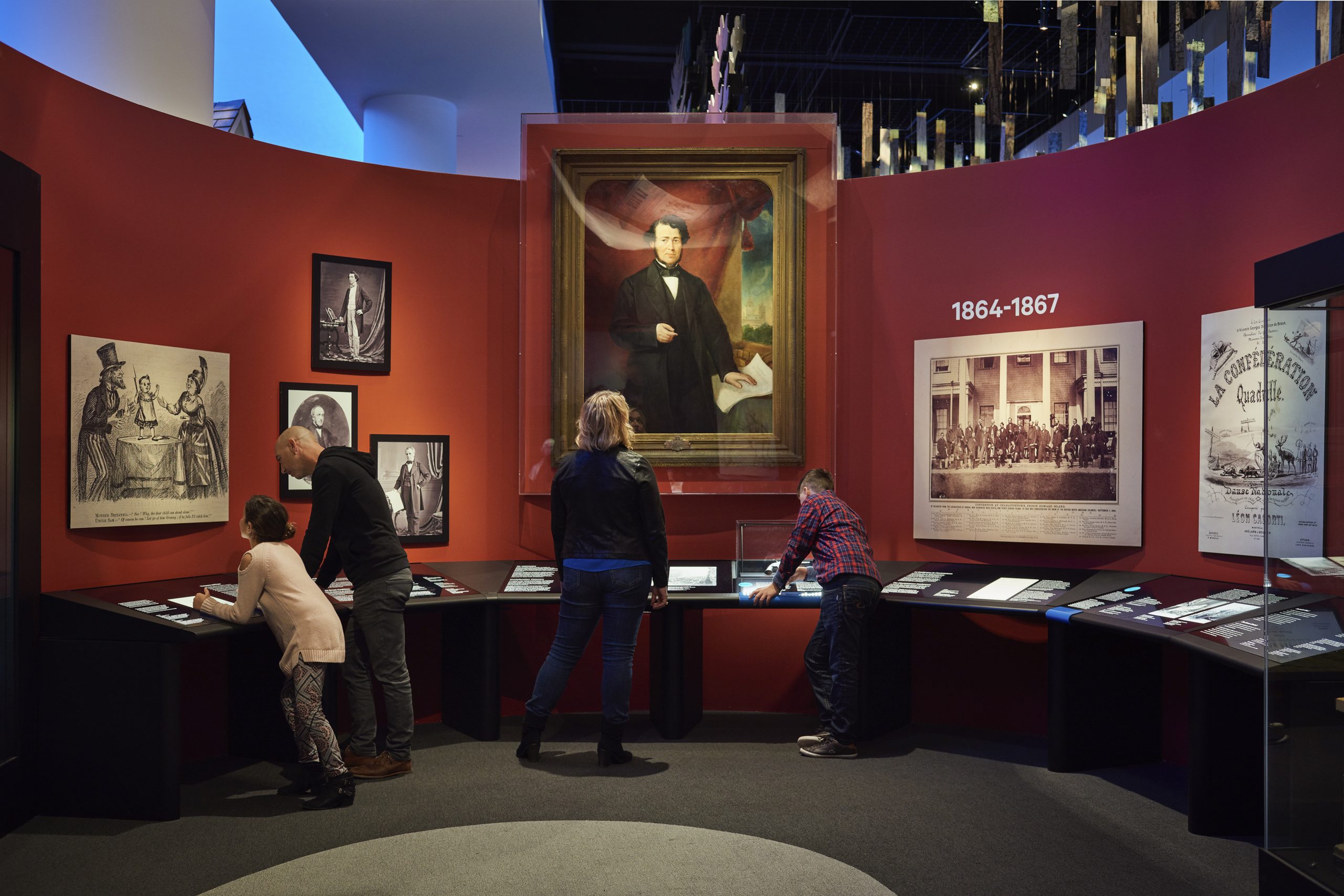 A group of people in Ottawa looking at exhibits in the Canadian Museum of History.