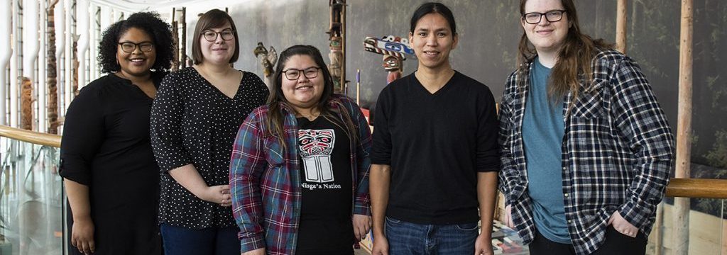 A group of people posing for a photo at the Canadian Museum of History in Ottawa.