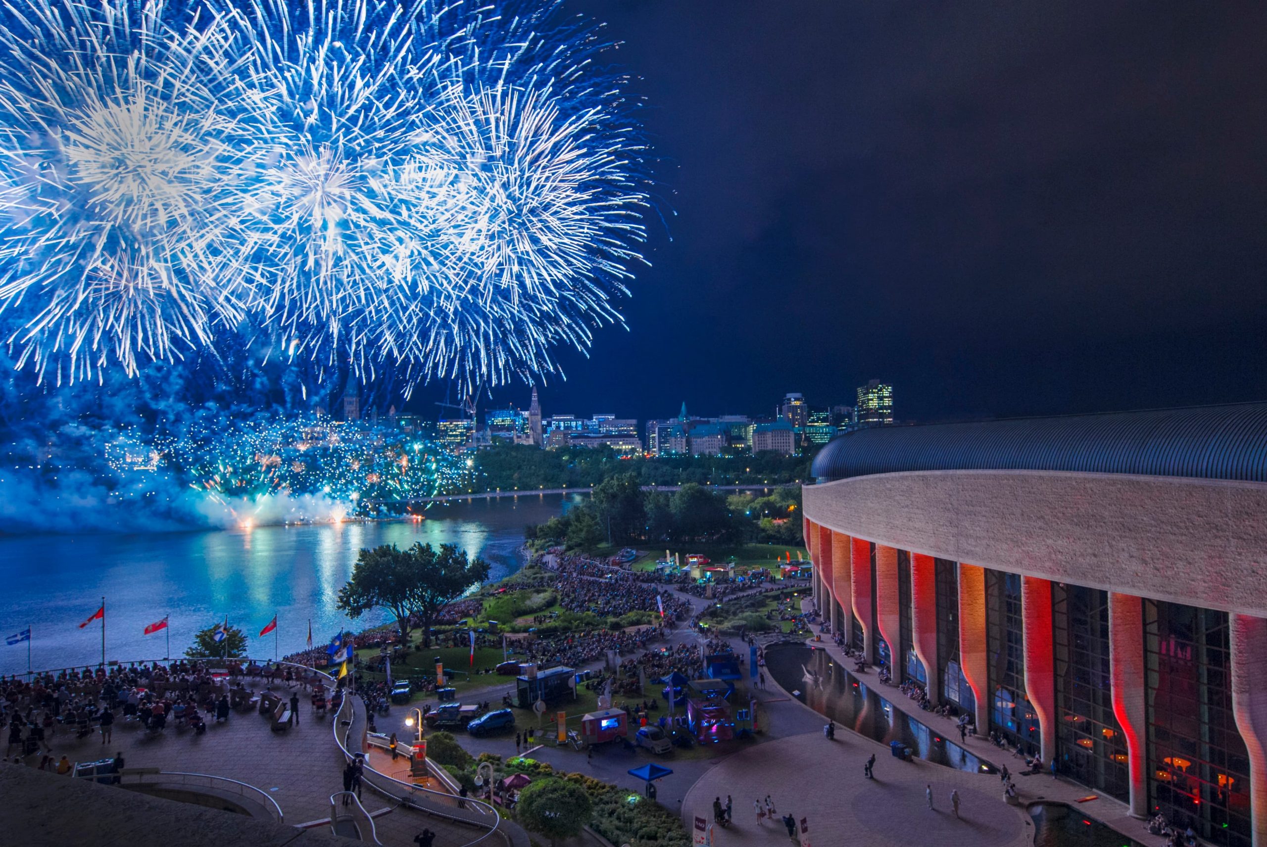 A blue and white fireworks display over the Canadian Museum of History in Ottawa.