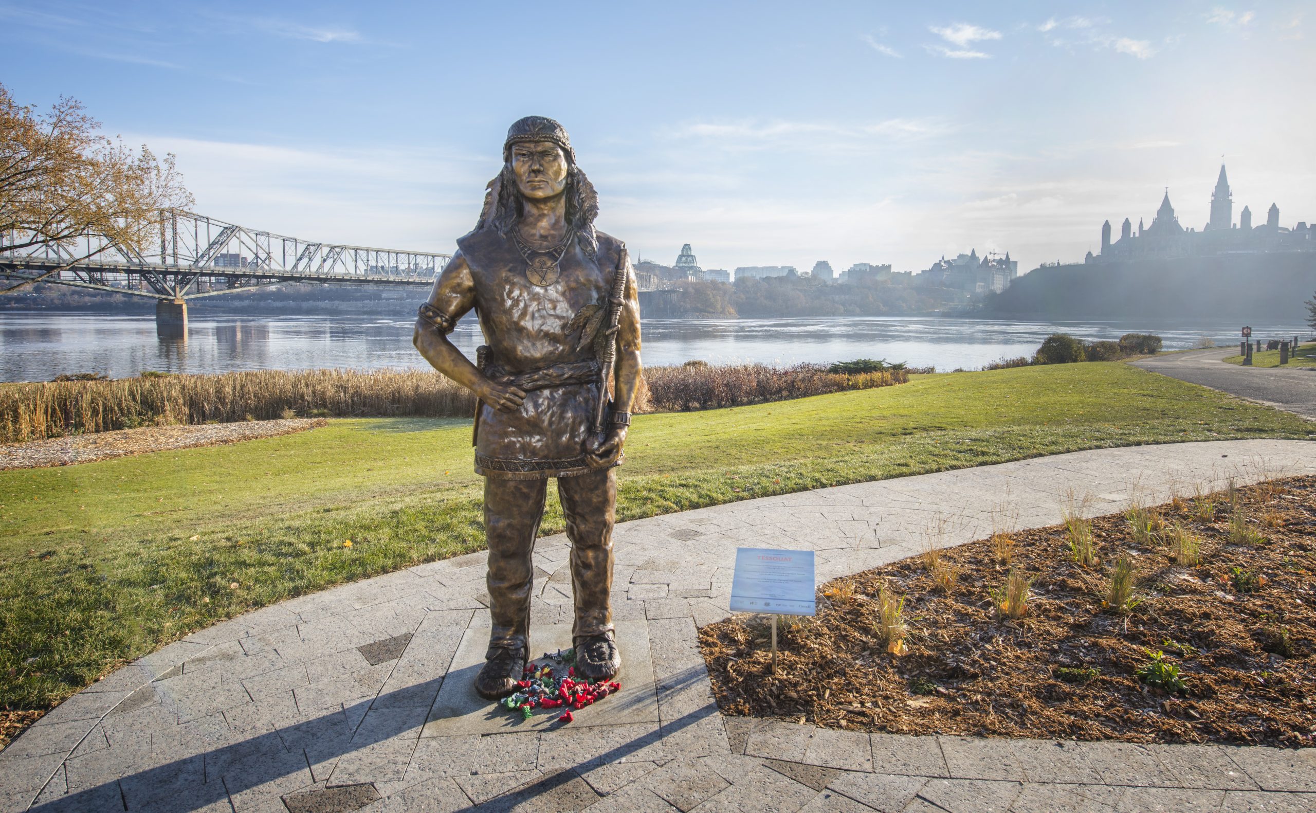 A statue of a woman in front of the Canadian Museum of History, in Ottawa.