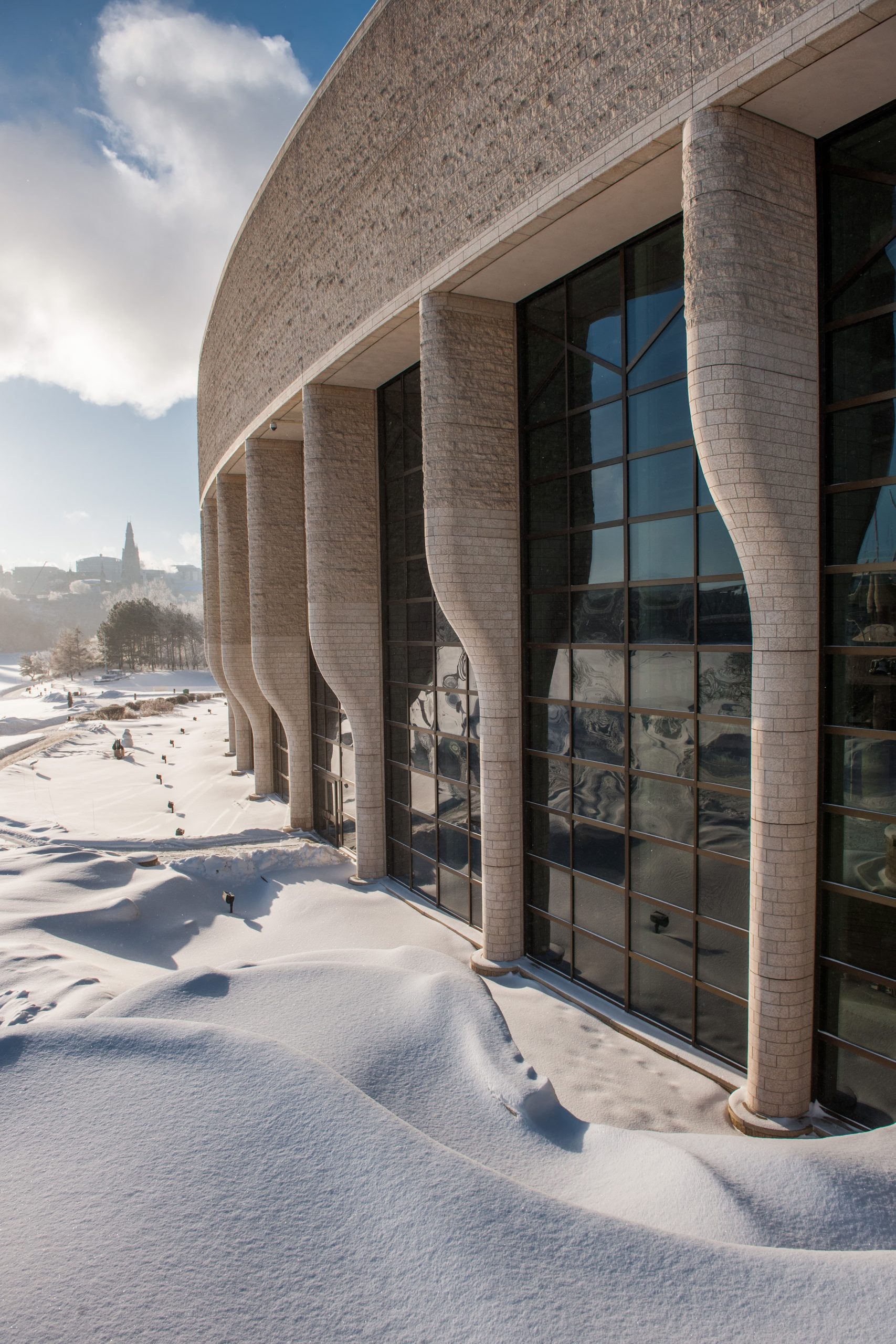 The Canadian Museum of History, located in Ottawa, is a stunning architectural marvel that becomes even more enchanting during winter. Covered in a pristine blanket of snow, this building presents a picturesque scene