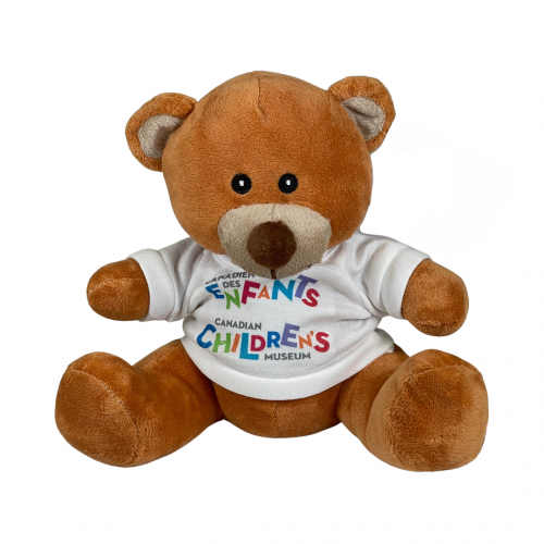 Timothy Bear stuffed animal wearing a white tshirt with the iconic logo of the Children’s Museum.