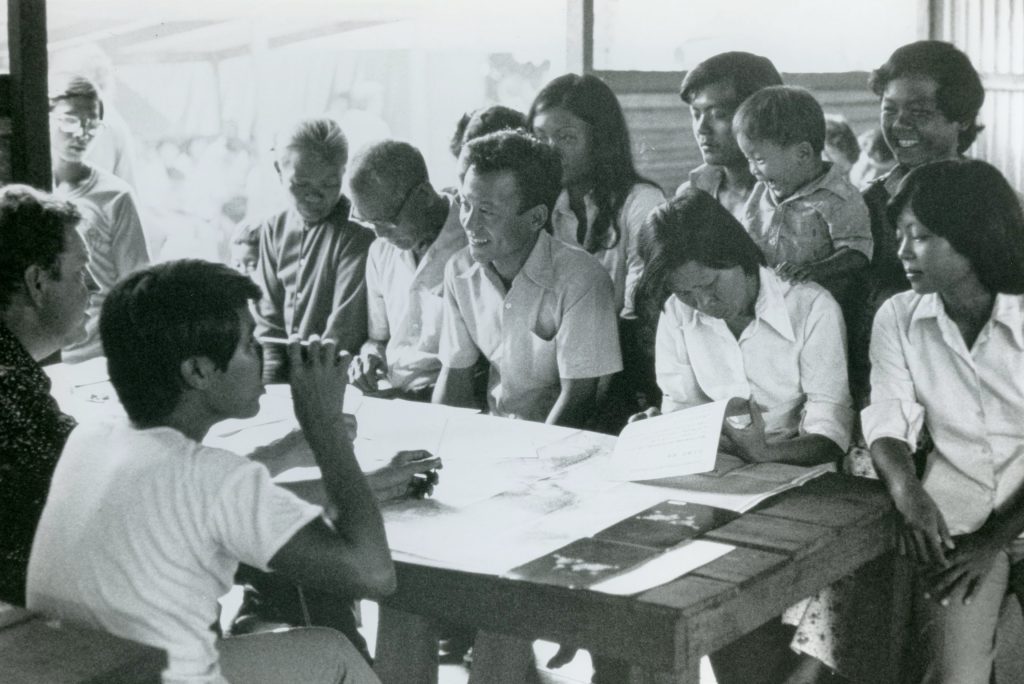 Refugee processing table in refugee camp.