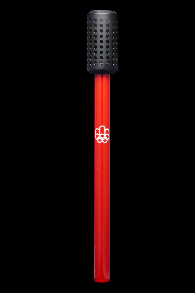 Red Olympic torch with a black end