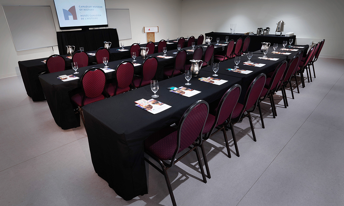 Tables and chairs set up for a presentation