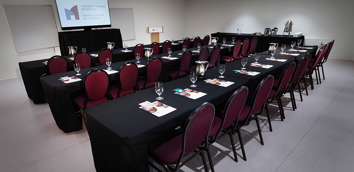 Tables and chairs set up for a presentation